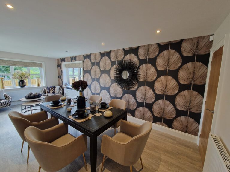 Dining room with statement leaf wallpaper