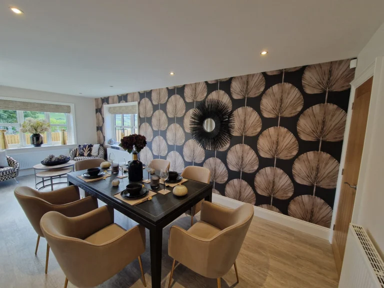 Dining room with bold fan-leaf feature wallpaper